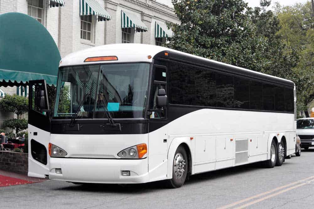 Charter bus parked outside a hotel